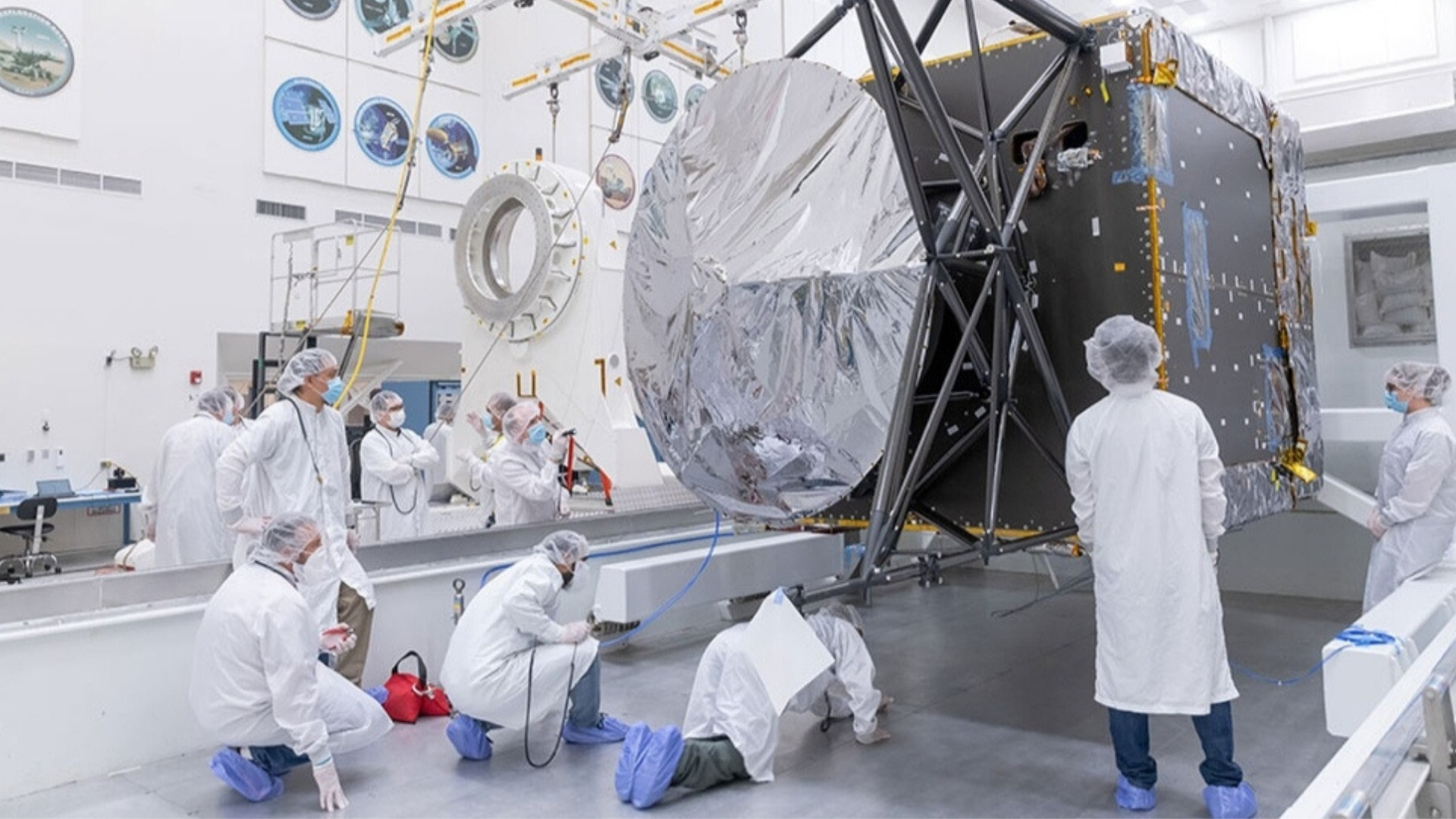 Engineers at NASA assembling spacecraft parts in a laboratory at Southern California