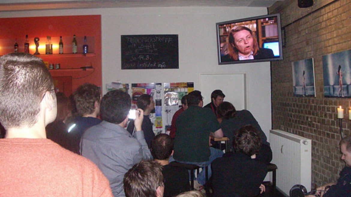 people watching a TV show